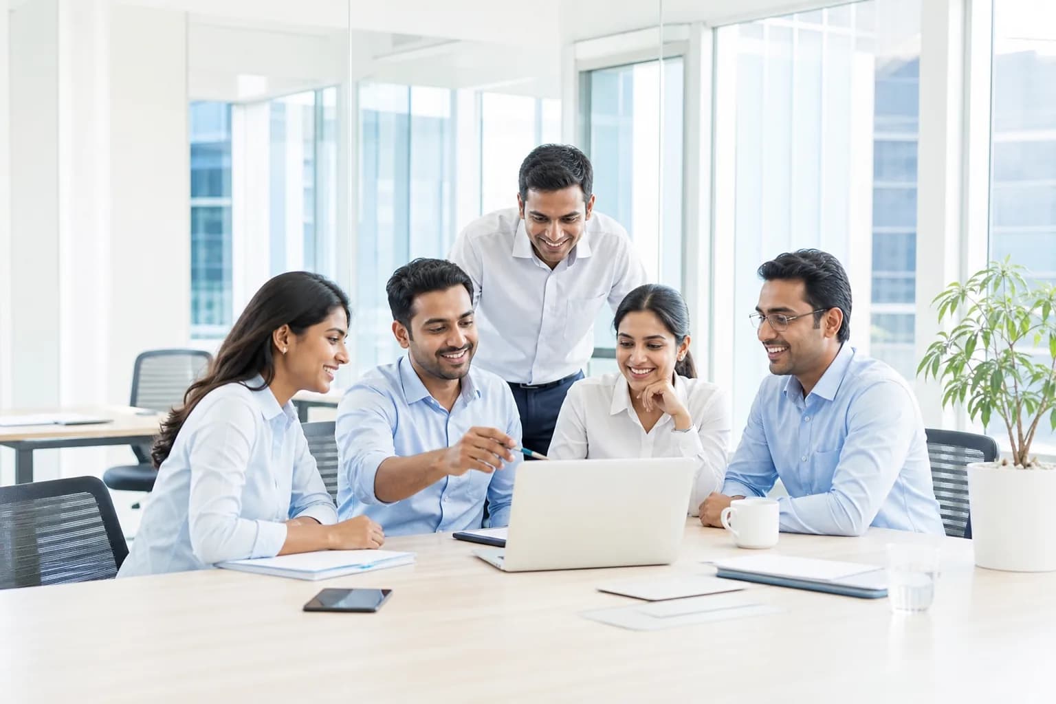 A Sansai team collaborating in a modern office